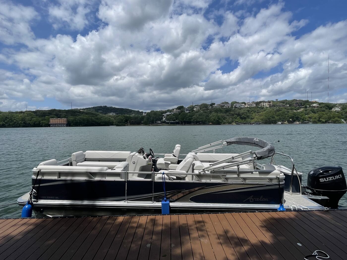 Side profile of the LakeTime 11-passenger pontoon on Lake Austin