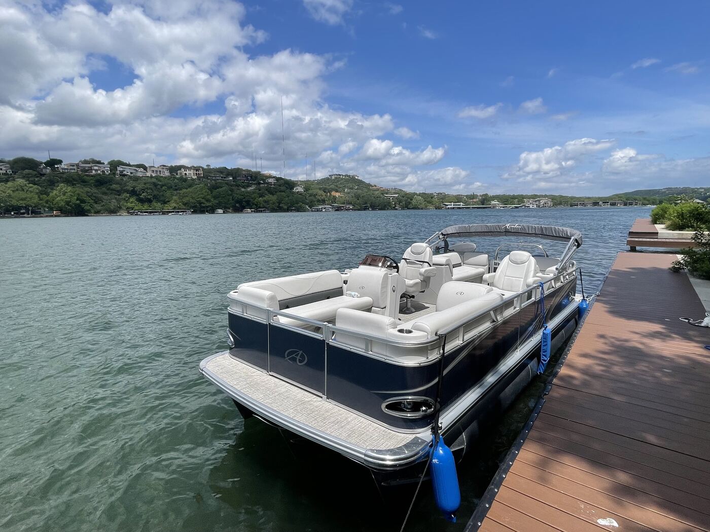 Front angle view of the LakeTime pontoon docked on Lake Austin