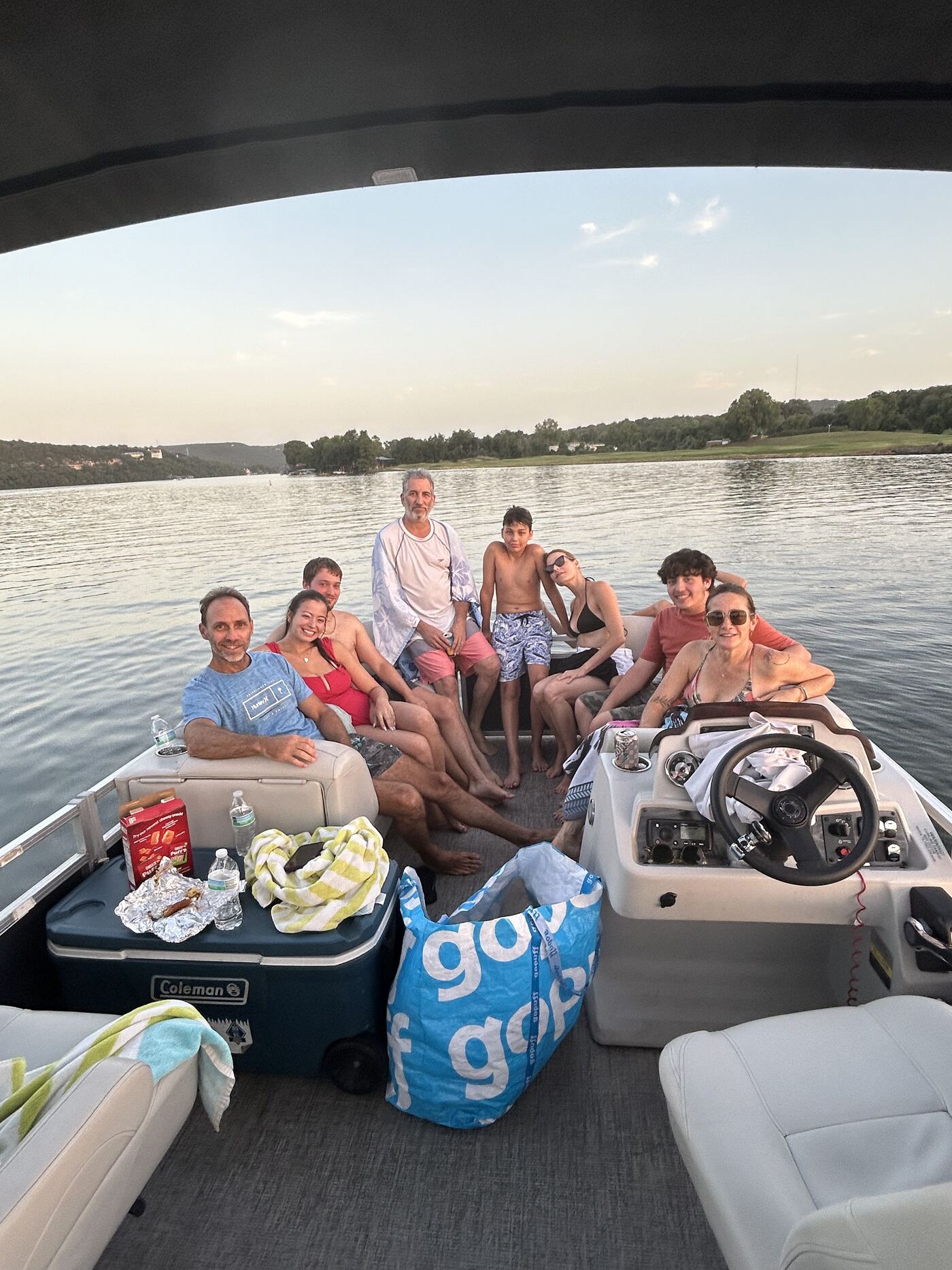Extended family group enjoying an evening cruise aboard a LakeTime pontoon
