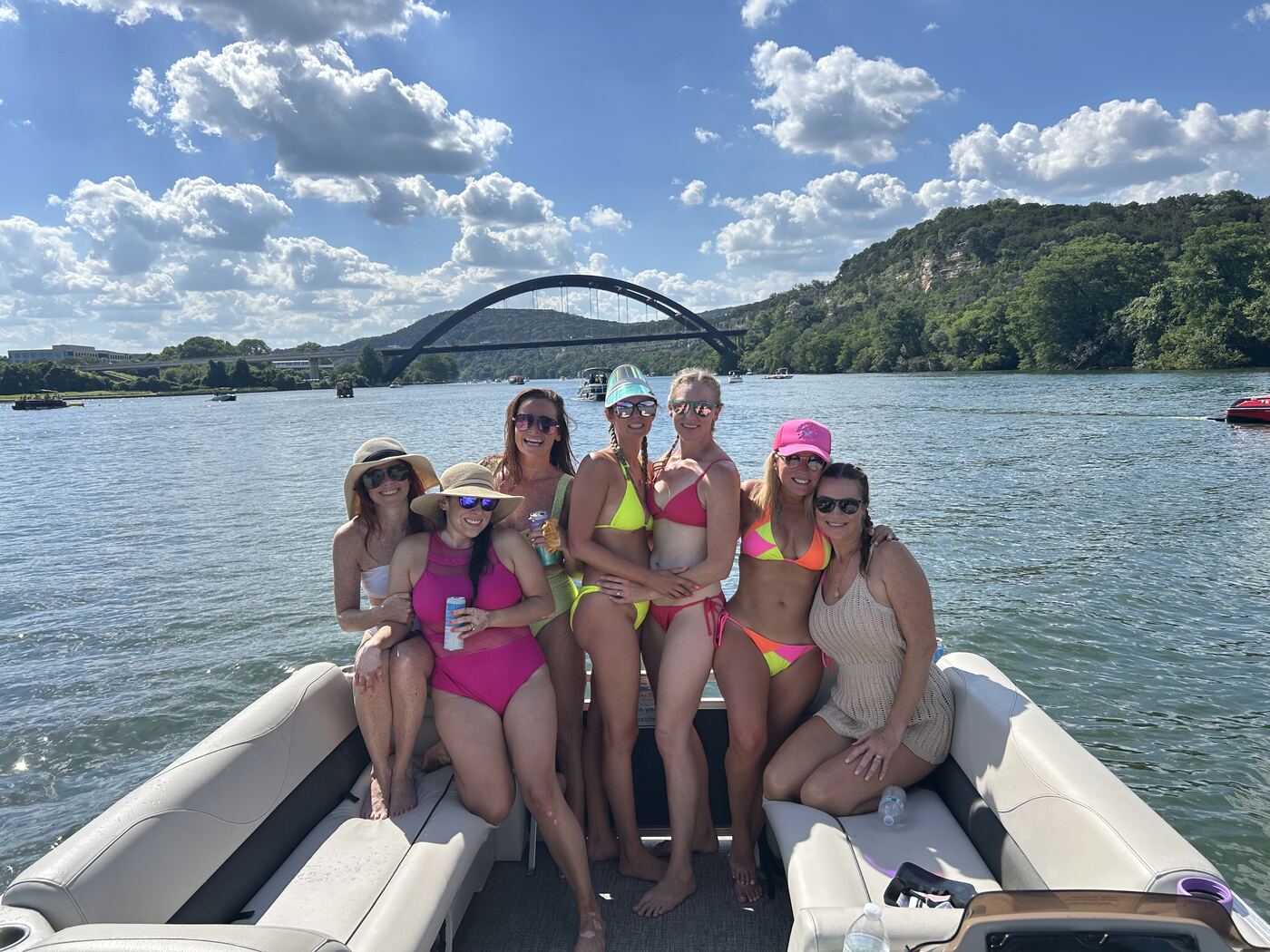 Bachelorette party celebrating on the floating mat on Lake Austin