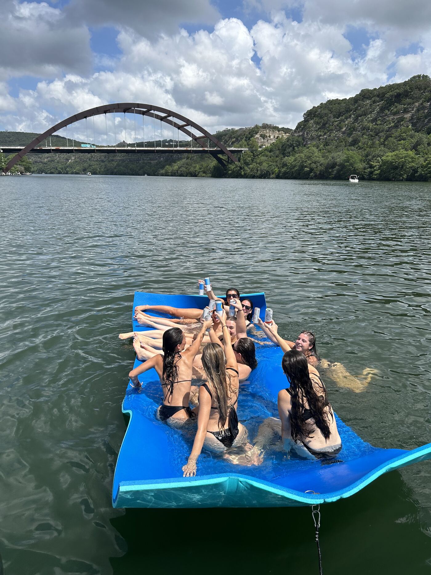 Bride squad celebrating aboard a LakeTime pontoon on Lake Austin