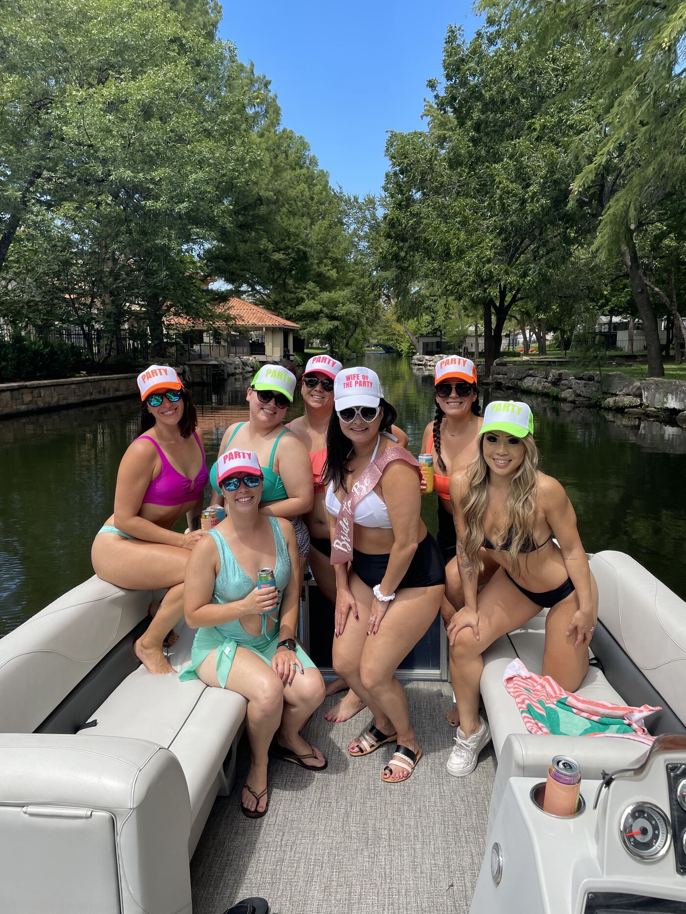 Group of friends posing together on a LakeTime pontoon on Lake Austin