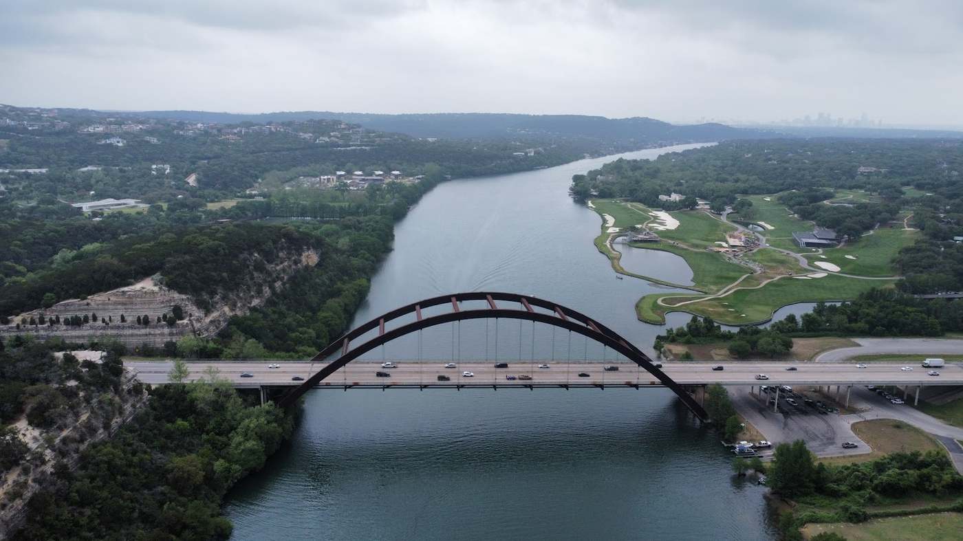 Aerial view of the Loop 360 boat ramp and Pennybacker Bridge on Lake Austin